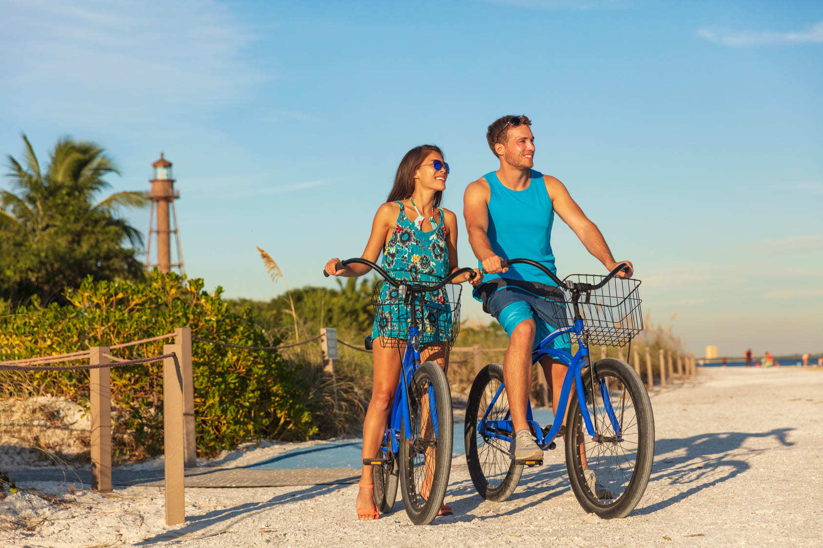 Couple cycling on a beach in Southwest Florida